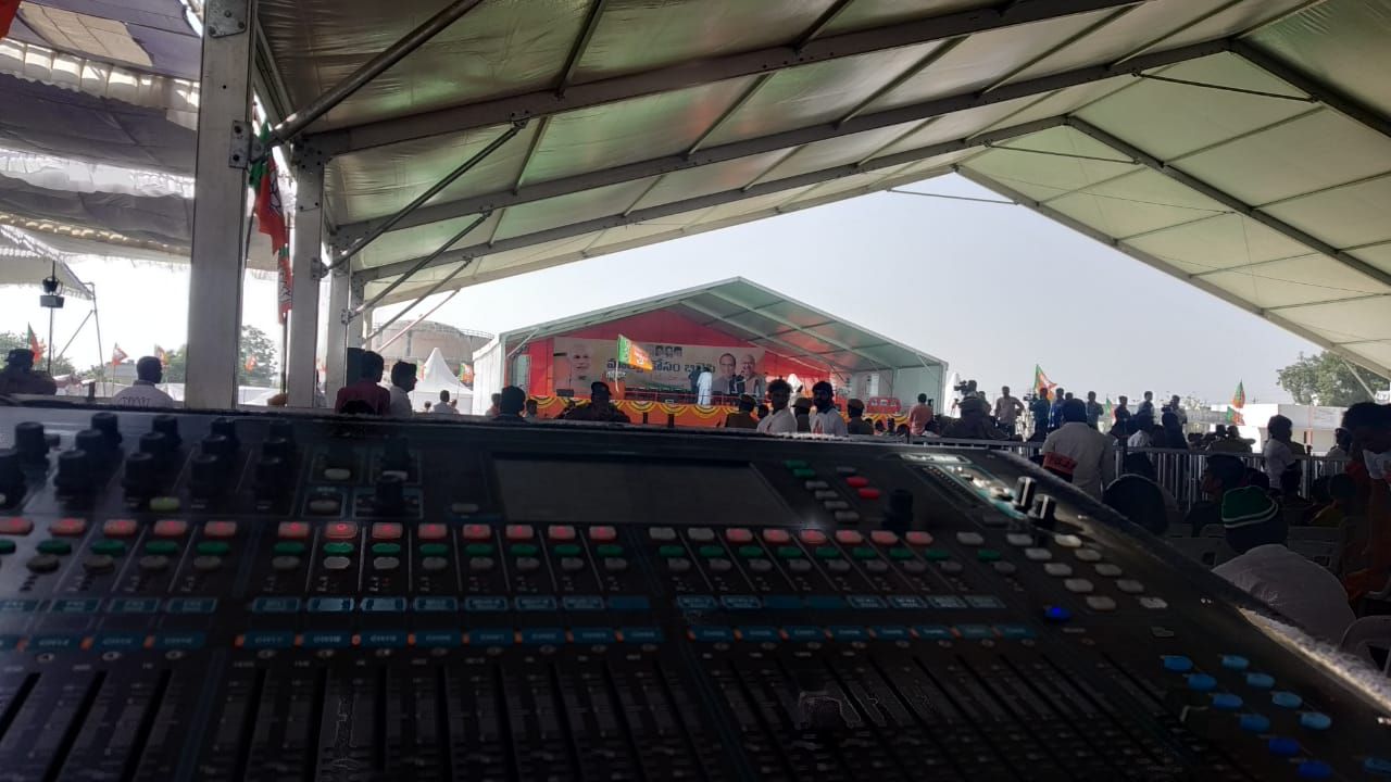 Sound mixing console at front of house in an event tent